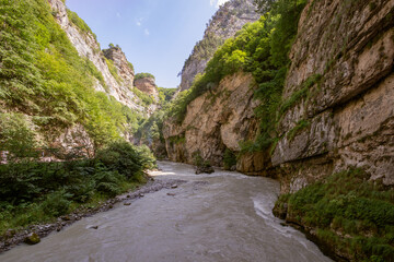 Mountain road close-up. Nature background with road close-up. Idyllic landscape with the Elbrus mountains. Chegem Gorge, Kabardino-Balkaria, Russia