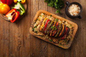 Roasted whole in sauerkraut, stuffed pork neck.