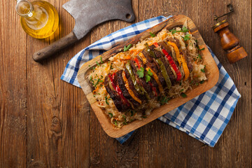 Roasted whole in sauerkraut, stuffed pork neck.