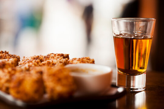Cup of Cacha&ccedil;a or Pinga, a traditional Brazilian drink made from sugar cane. High quality photo