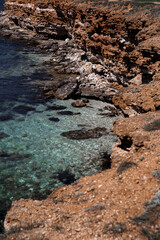 Yellow seashore with blue water