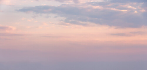 Naklejka na ściany i meble Beautiful clouds in the twilight, pastel pink