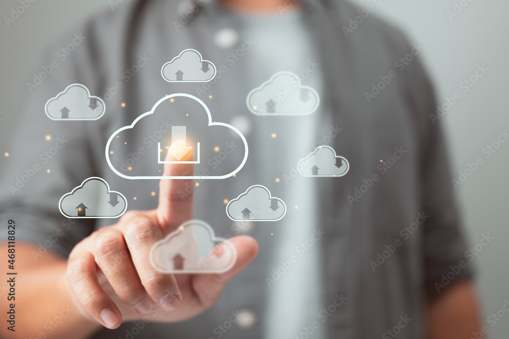 Leinwandbilder The download cloud button is pressed by a man. Cloud computing is a method of storing and exchanging large amounts of data.