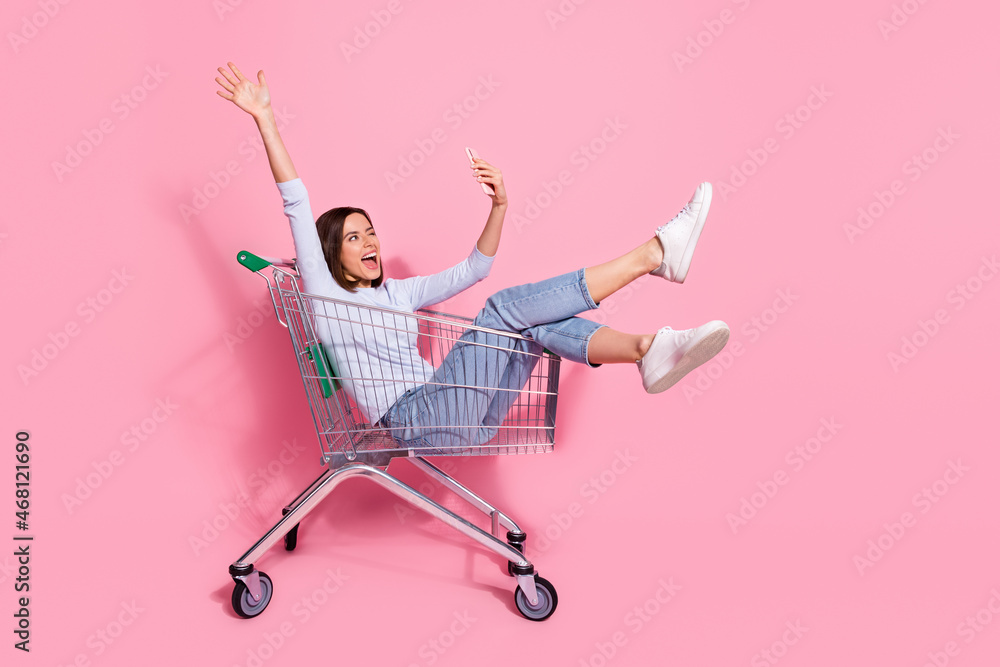 Poster photo of funky pretty young lady dressed white jumper tacking selfie modern device having fun shoppi