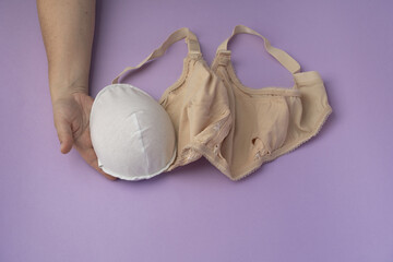 Breast prosthesis before inserting it into the special bra. Breast prosthesis and post surgery bra for breast cancer patient after mastectomy.