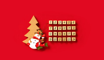 Advent calendar of wood block on red background....