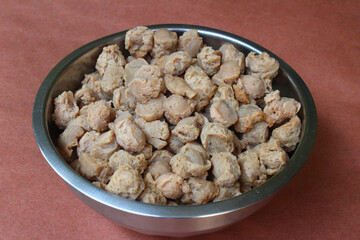 Closeup of boiled soya chunks in a steel bowl