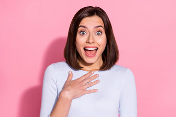 Photo of shocked excited young woman wear white sweater open mouth arm chest shopping sale isolated...