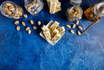 White chocolate covered nougat. Nougat with pistachios and almonds. These delicious confections are...