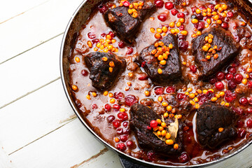 Delicious fried beef in berry marinade