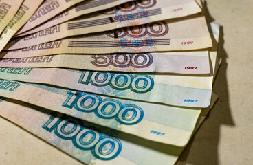 Fototapeta na wymiar Selective focus. Blurred. Bundle of banknotes rubles in russia