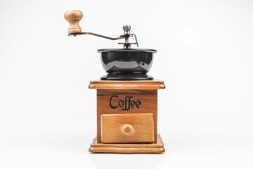 Image of making coffee. Coffee grinder on white background
