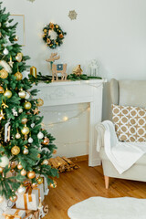 Living room with Christmas decorations. Christmas tree, gift boxes, cozy armchair, pillows, fireplace.