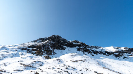 Fototapeta na wymiar Snow covered mountain peaks