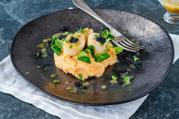Scallops with butternut squash mash, caviar and lime and butter sauce