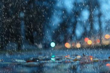 wet window city lights rain drops, abstract background autumn winter glow glass