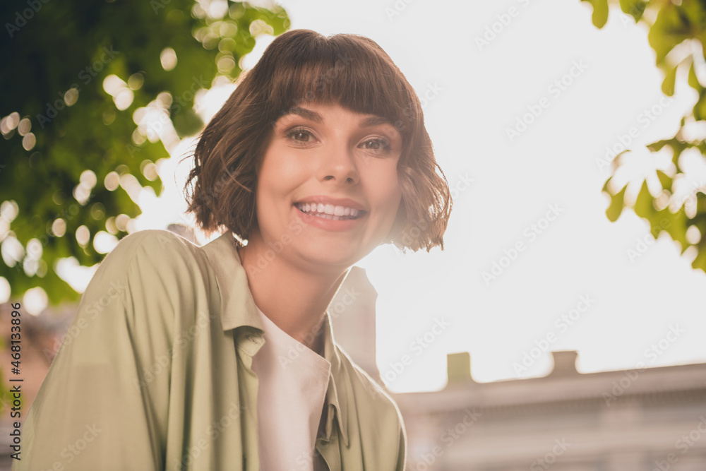 Sticker Photo of adorable cute young woman wear green shirt rucksack smiling walking outside city street