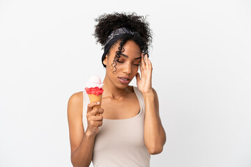 Young african american woman with a cornet ice cream isolated on white background with headache