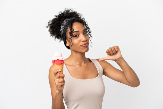 Young african american woman with a cornet ice cream isolated on white background proud and self-satisfied