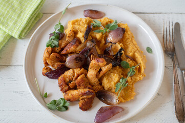 Fitness meal with turkey breast, mashed sweet potatoes and red onions