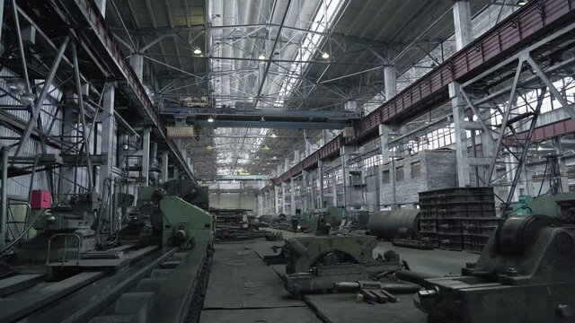 Industrial interior of metalworking factory. Workshop with many machine tools for metal processing, grinding, drilling and cutting. Heavy industry.