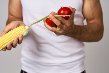 a man in a white t-shirt vegetables food diet strength snack isolated background