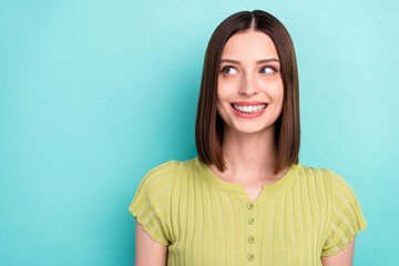 Photo of curious dreamy positive lady look empty space wear green blouse isolated turquoise color background