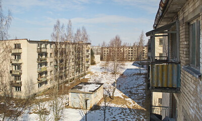 Fototapeta na wymiar Abandoned white brick multistorey houses. Forgotten, abandoned ghost town Skrunda, Latvia. Former Soviet army radar station.