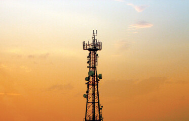 From top to antenna tower on a sky background. - obrazy, fototapety, plakaty