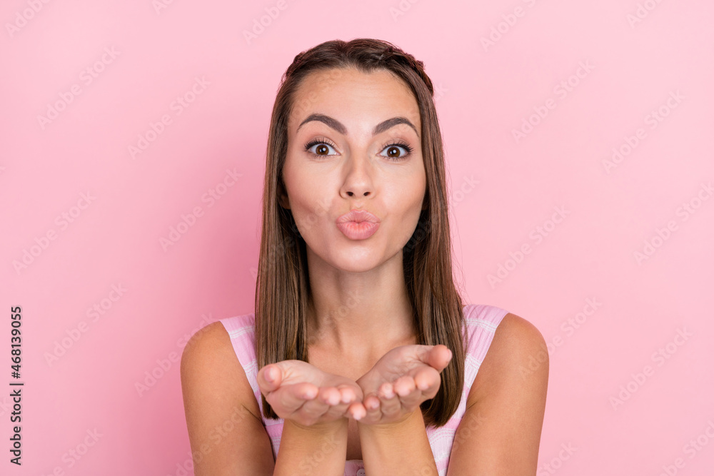 Sticker Photo of young attractive lady send air kiss you arms flirty valentine day love isolated over pink color background