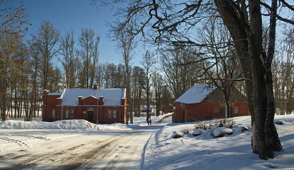 Red brick buildings on a sunny winter day, Pelci, Latvia.