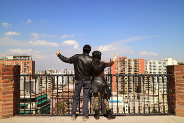 Couple Thumbs-up to the Impressive City View at the View Point of Santa Lucia Hill, Santiago, Chile, South America