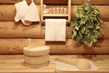 Traditional accessories for bath treatments in sauna interior. 