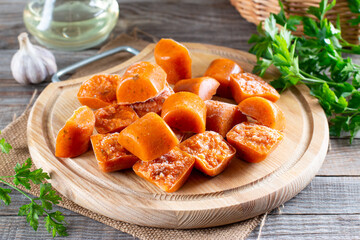 Frozen vegetable cubes on a cutting board. Life hacks, simple way to store vegetables