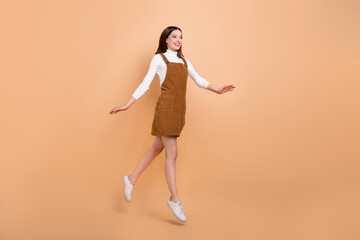 Full size profile photo of excited overjoyed person look empty space arms flight isolated on beige color background