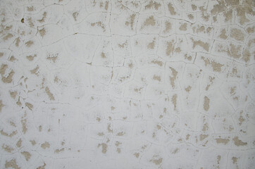 Texture of the old stucco wall. Cracked stucco wall background