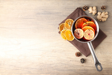 Concept of cooking  mulled wine on wooden background