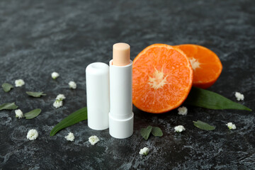 Concept of cosmetic with eco hygienic lipstick on dark background