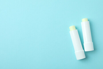 Eco lipstick on blue background, space for text