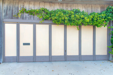 Closed bifold garage door with gray frames at Oceanside, California