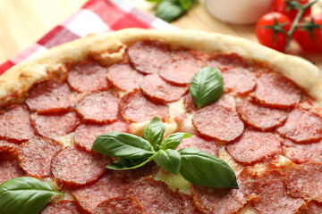Concept of tasty food with Salami pizza, close up