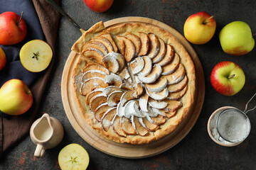 Concept of tasty food with apple pie on textured background