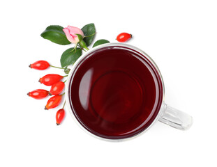 Aromatic rose hip tea, flower and fresh berries on white background, top view