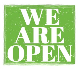 WE ARE OPEN, text on green stamp sign