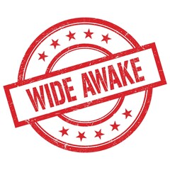WIDE AWAKE text written on red vintage round stamp.