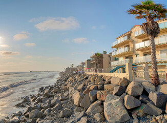 Gated accommodation buildings with palm trees outside at Oceanside, California