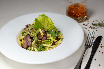 warm salad with veal and fresh lettuce
