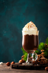 Hot milk chocolate with whipped cream. Winter and autumn warming drink. Copy space