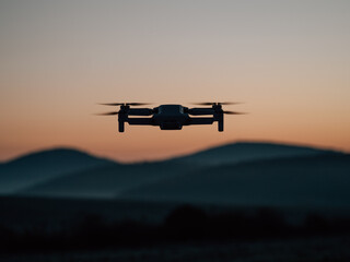 Drone flying at sunset. Drone photography or cinematography