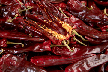 Several red peppers are lying on the floor